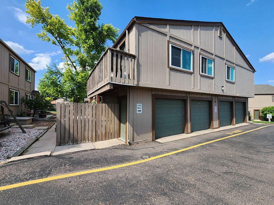 Townhome building. This is unit 17C. Garage furthest on the left is for the unit and has an internal entrance from garage. The fence and deck on the left is also for the unit.