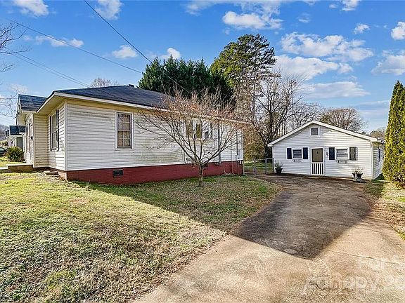 House, driveway, and building