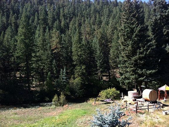 Backing to open space, enjoy a hot tub on the river