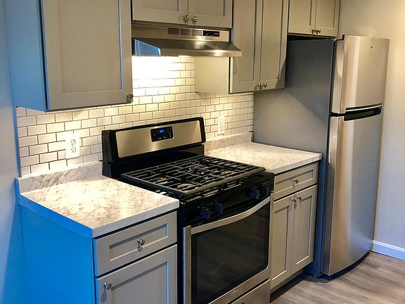 New Stainless Gas Range, Refrigerator, Under LED Lighting, New Cabinets Soft Close, New Countertop, Subway Tile