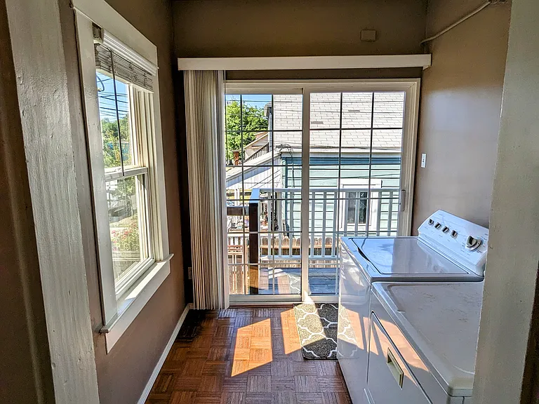 Private laundry room just off the kitchen with washer and dryer included.