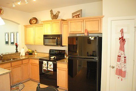 Kitchen Over Looks Formal Dining area and Living