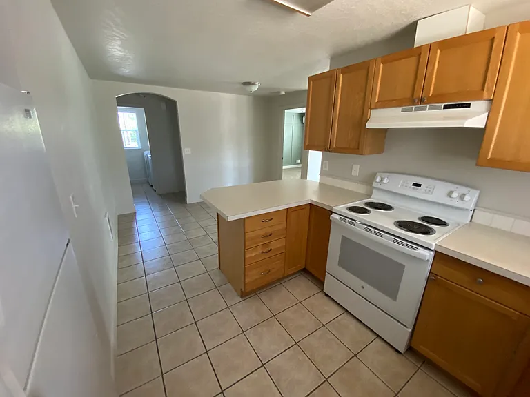 Kitchen with dining area in background