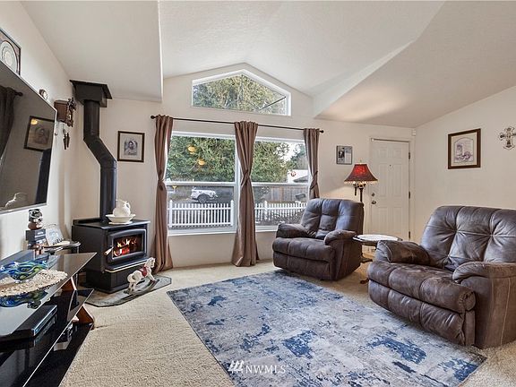 Plenty of light and vaulted ceilings invite you into this spacious home with nice gas fireplace to keep you warm.