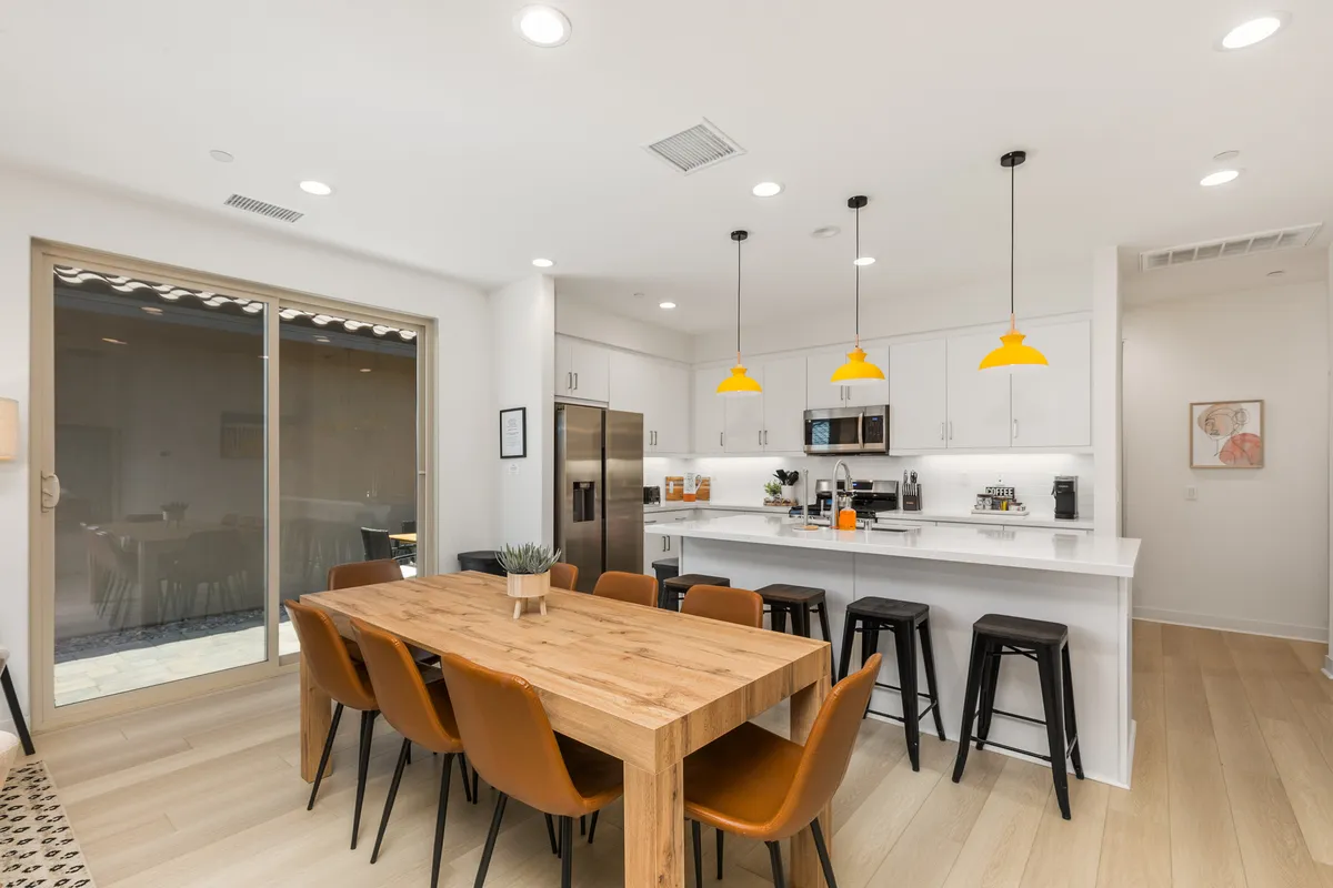 Open Kitchen and dining area that leads to the side yard patio - 80401 Redstone Way