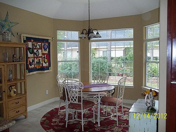 Breakfast nook just off kitchen with lots of windows for added sunlight.