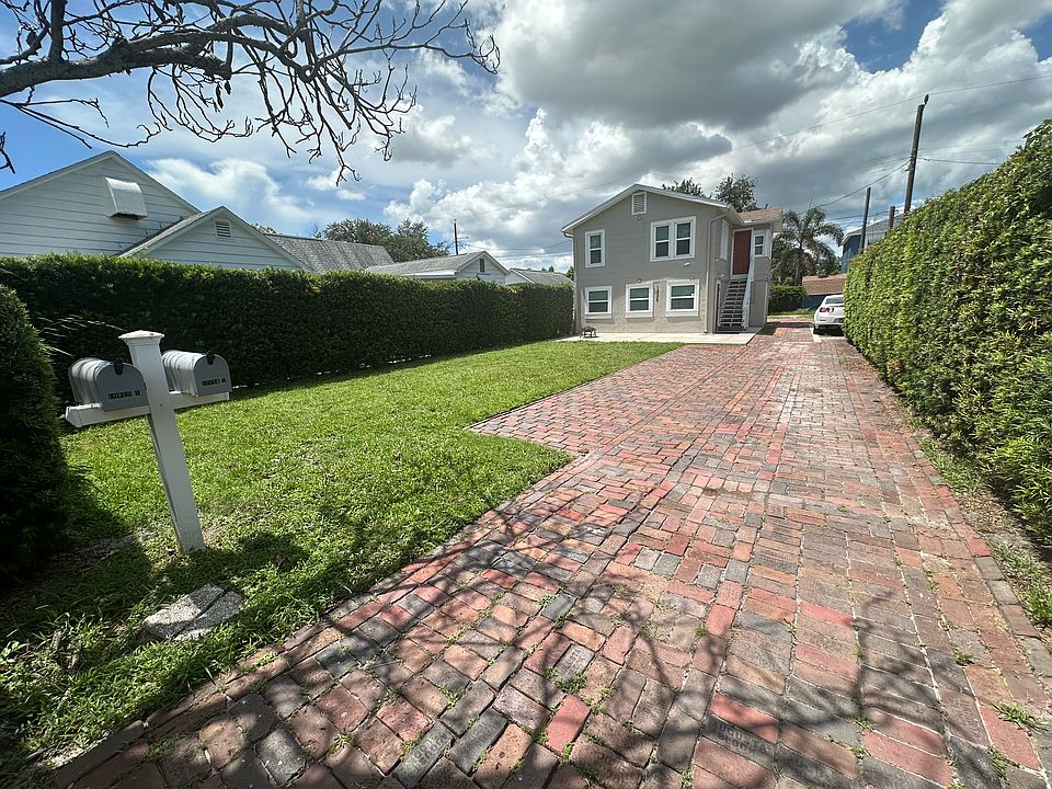 Green space in front of apartment. Hedges line both sides and is maintained weekly by lanlord.