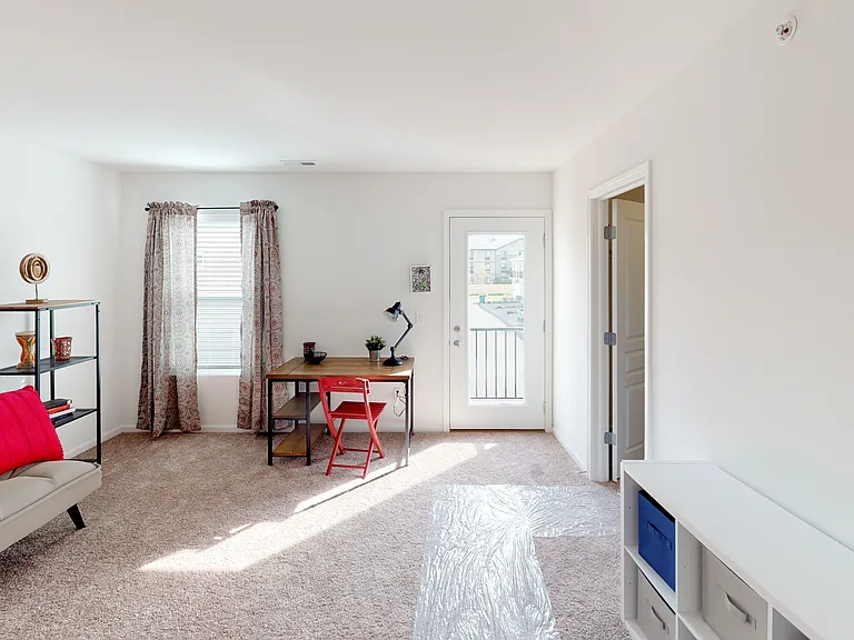 Secondary bedroom with attached en suite bathroom and walk in closet