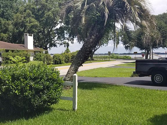 View of stunning Lake Dora from the front yard and ideally l