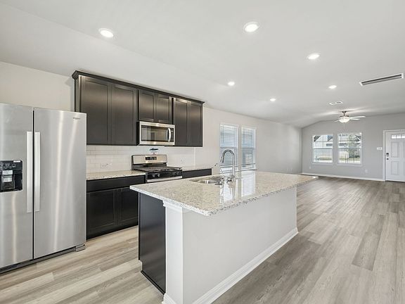 Have clear views of the living and dining areas from the kitchen.