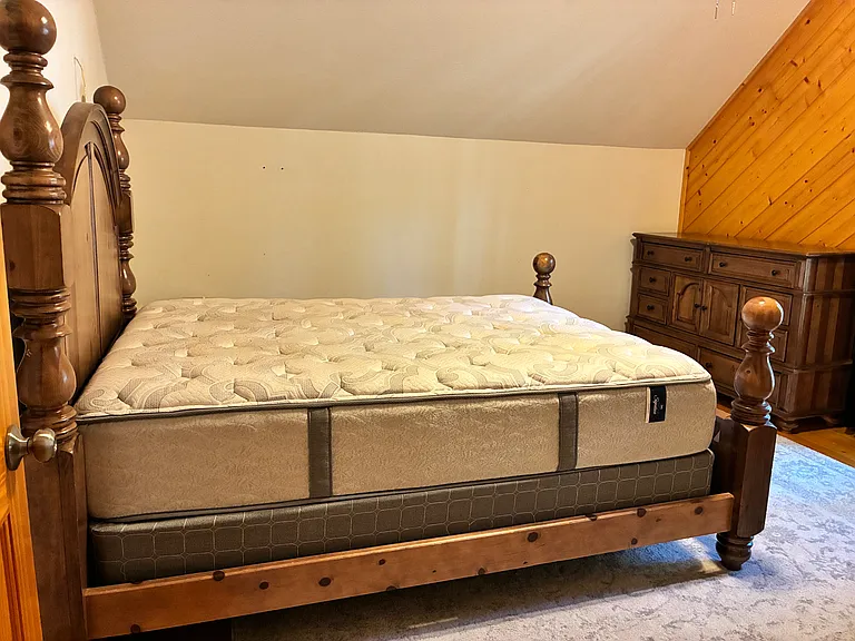 Queen size bed and large dresser upstairs bedroom