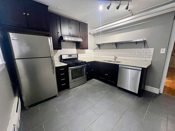 kitchen with dishwasher and tile floors!