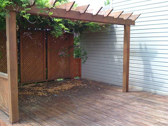 Whisteria Draped Arbor Provides Summer Shade