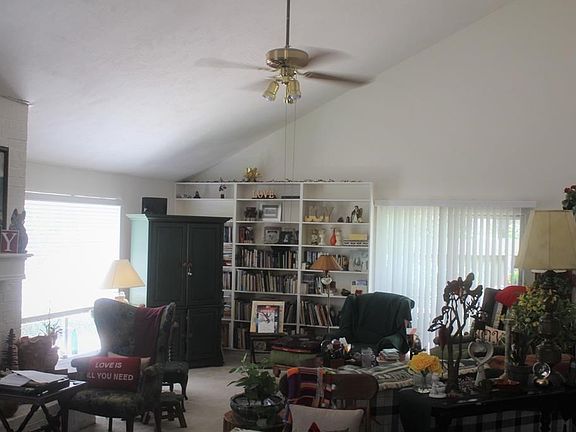View of living room/. Fire place . Lots of natural lighting. Plenty of room for furniture after everything has been moved out.