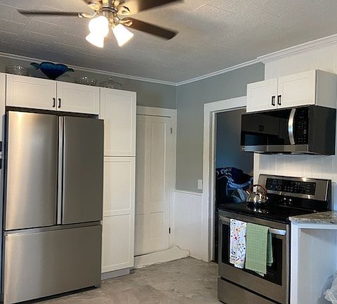 Newer Electric stove and newer fridge. Access to basement as well.