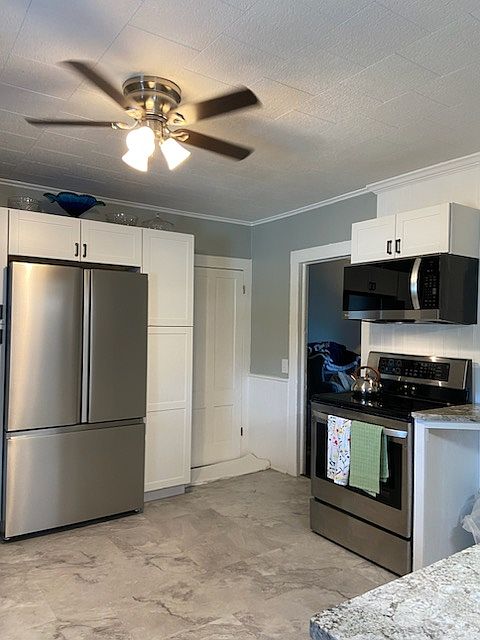 Newer Electric stove and newer fridge. Access to basement as well.