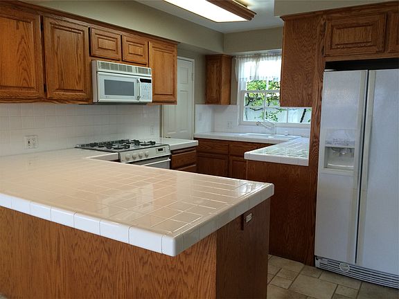 Kitchen with d/w, fridge, microwave & oven