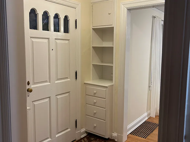 Entryway with built in shelves and drawers
