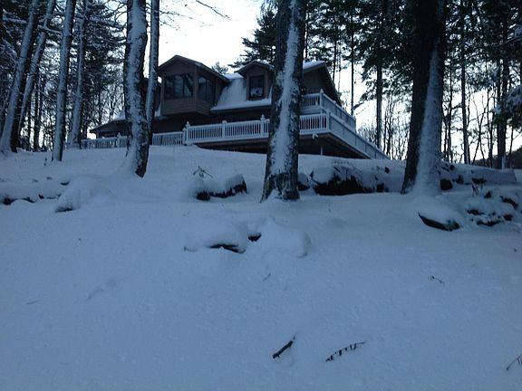 Winter scene View of home facing lake