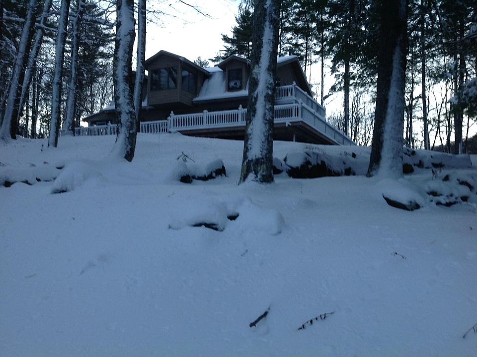 Winter scene View of home facing lake