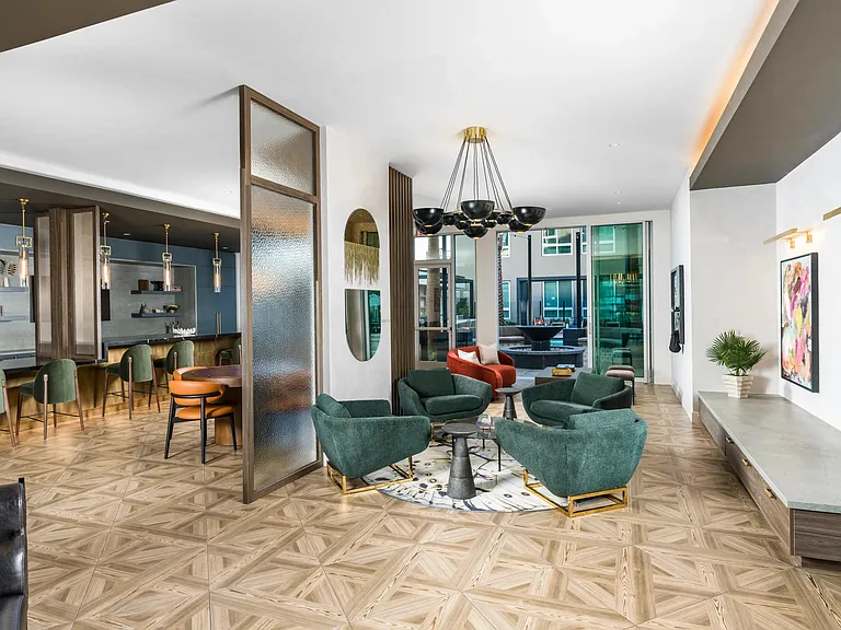 Modera Pomona offers a game room with a poker table and ample seating.