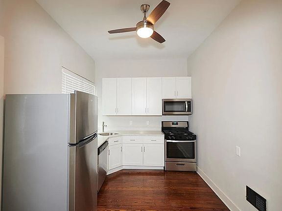 Very tall ceilings and ceiling fans in every room.