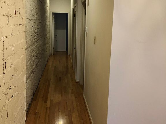 hallway from living/dining area to bath and 2 bedrooms.