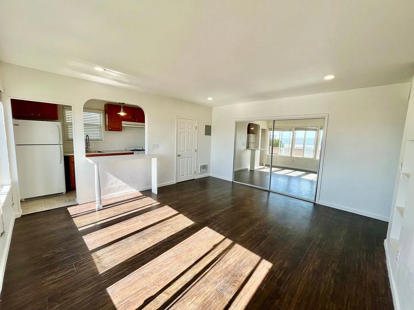 Spacious Studio with Archways, Kitchen Island, Onsite Laundry, and Natural Light! — Photo 4