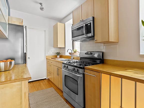 3rd image of 303 E 8th St APT De