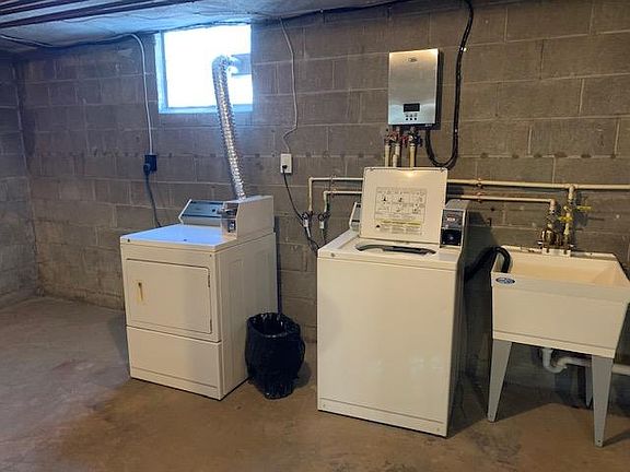 shared coined laundry in the basement