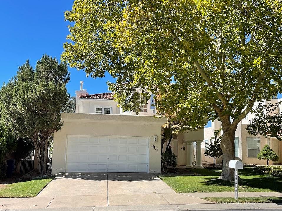 Front of house. 2 car garage.