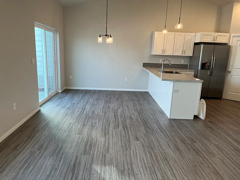 Dining area, sliding door leading to patio and fenced back yard