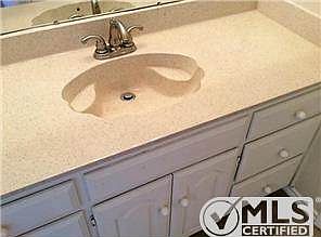 Baths are complete with large vanities with good storage.