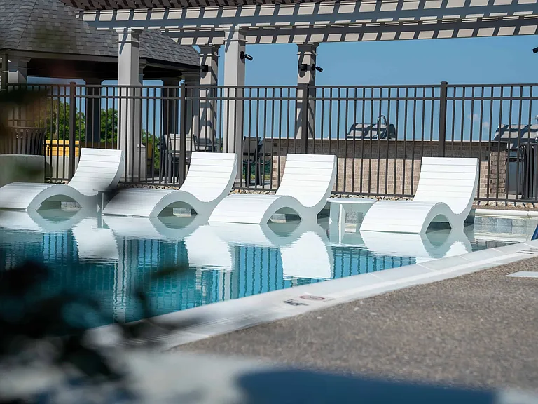 Pool Lounge Chairs at Vicinity Apartments