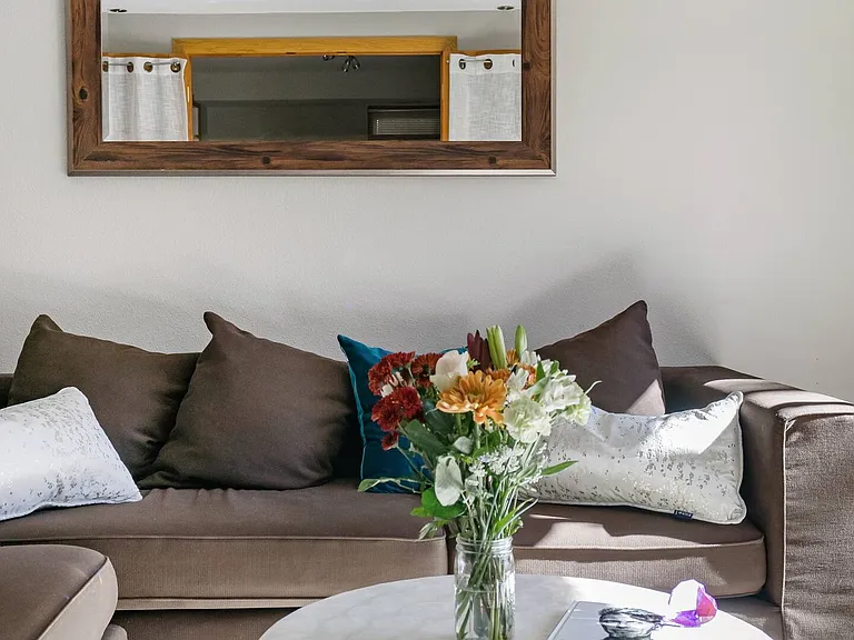 Bright and sunny basement/lounge/TV room with working gas fireplace.