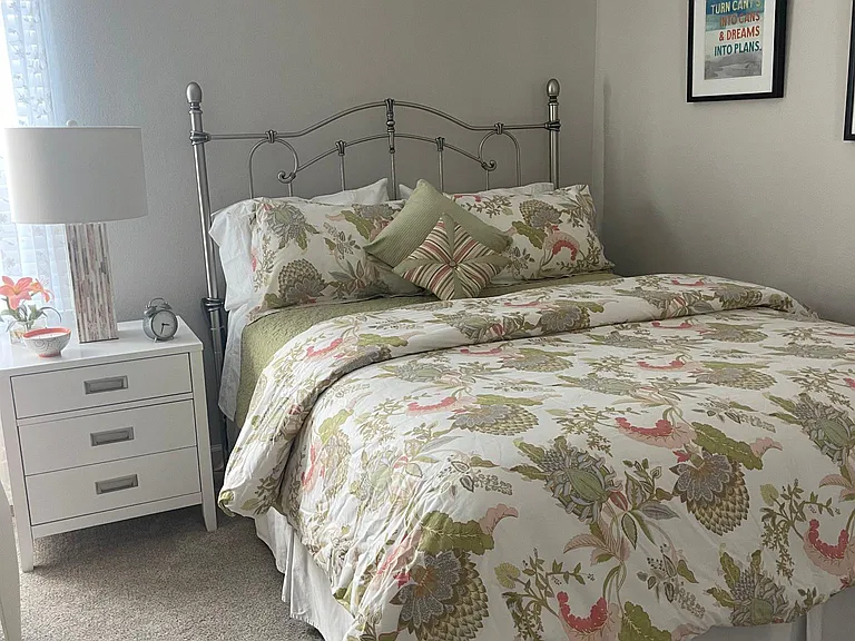 Warm and cozy guest bedroom with comfortable queen-size bed.