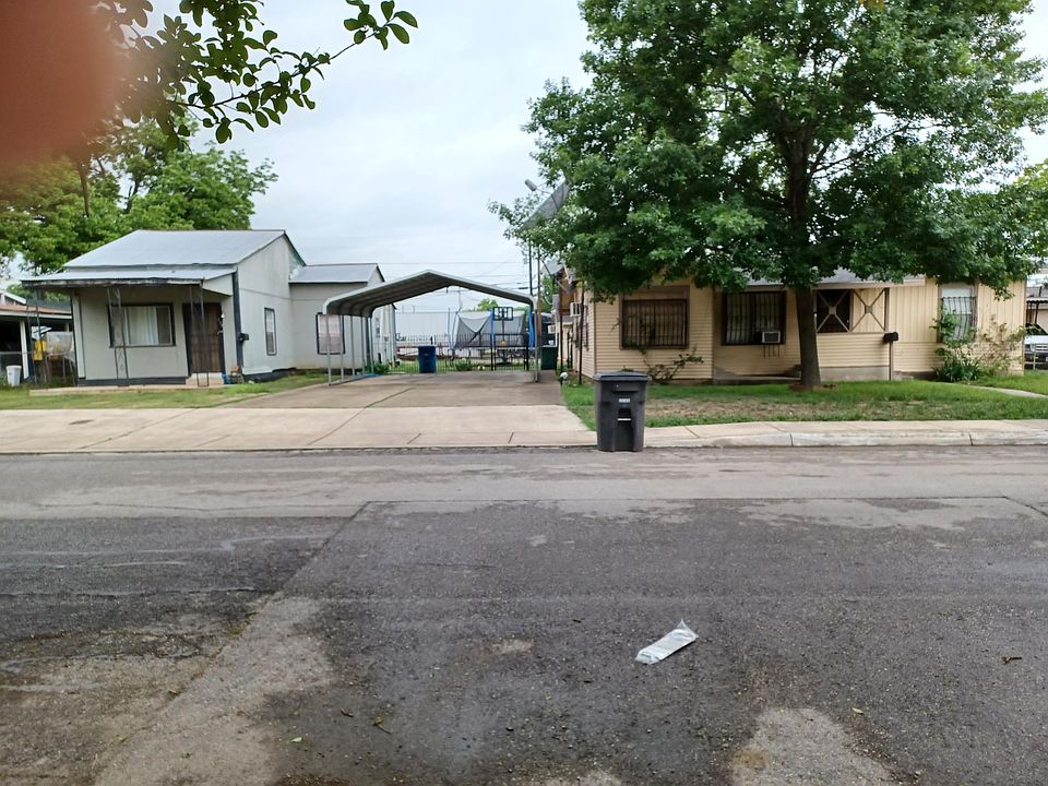 Front of home and 2 car carport.