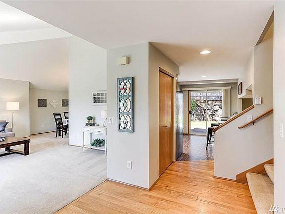 Enter to a freshly painted home with an open floor plan and vaulted ceilings. 