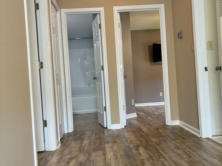 From the top of second floor landing. Owner's suite to the left, then moving clockwise: hall closet, full bath, spare bedroom, laundry room, third bedroom (sliding barn door closet) outside of camera shot to the right.