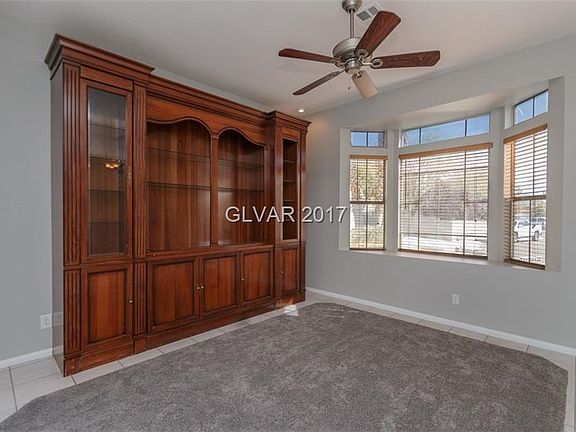 FRONT FORMAL LIVING AREA*ENTERTAINMENT CENTER GIVES THE ROOM AN ELEGANT FEELING*NICE ROOM TO ENTERTAIN IN