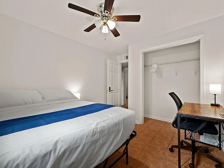 Bedroom 6 with bed, desk, table, and 2 lamps (1)