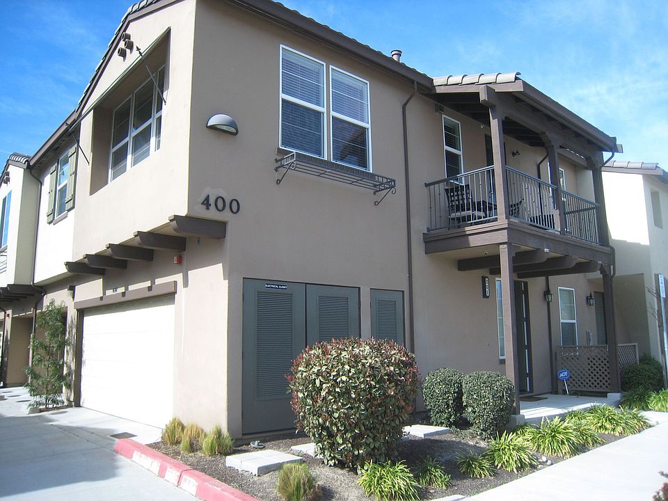 Corner windows, patio, and two car garage