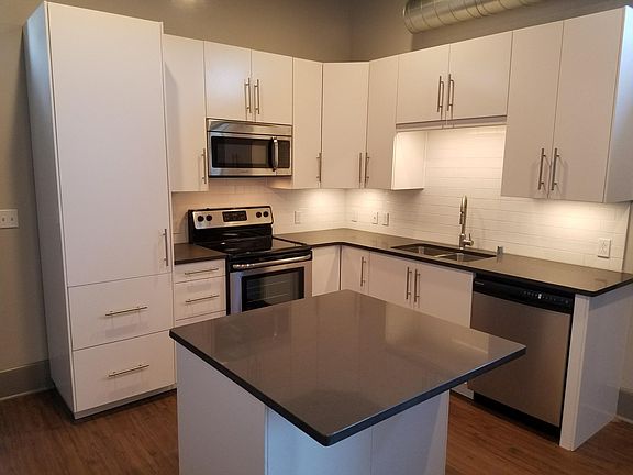 Well appointed kitchen including dishwasher, range, microwave, island and great cabinets!