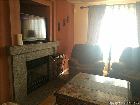 Gas fireplace with Granite surround.