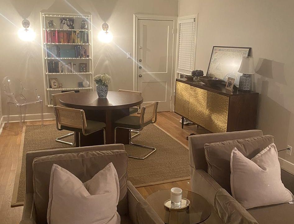 Dining area with original built in book case and cut sconces!