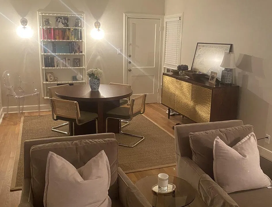 Dining area with original built in book case and cut sconces!