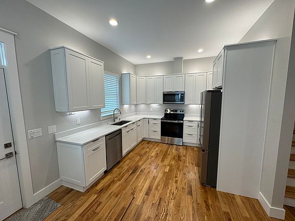 Kitchen (refrigerator, dishwasher, range, microwave & disposal included)
