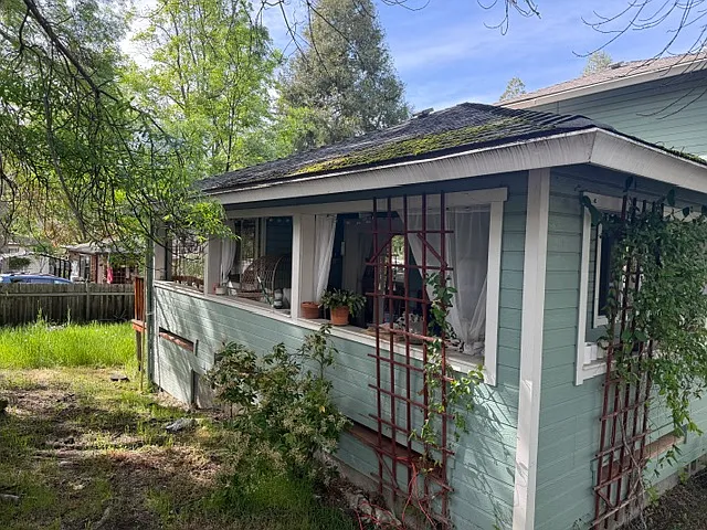 covered porch with fenced backyard view