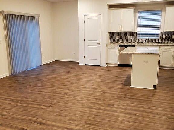 Kitchen and dining area with upgraded vertical blinds