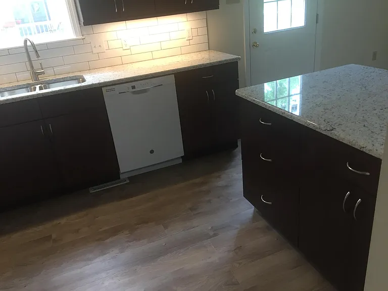 Kitchen showing bar area and deck access